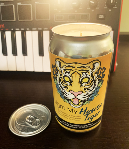 Photo of Light My Tiger, House Tiger Candle in front of keyboard midi controller